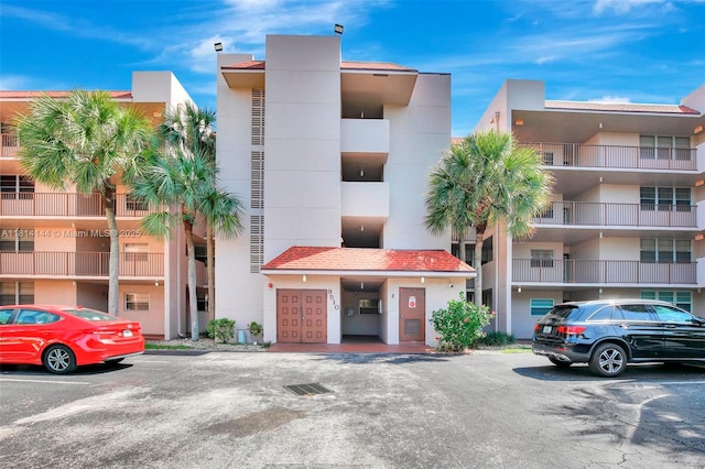 9510 Seagrape Dr Unit 101, Davie, FL 33324 - view of apartment building / complex featuring uncovered parking