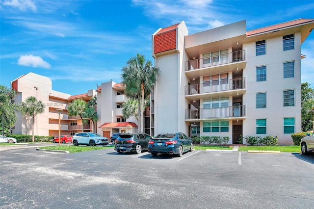 9510 Seagrape Dr Unit 101, Davie, FL 33324 - view of apartment building / complex with uncovered parking