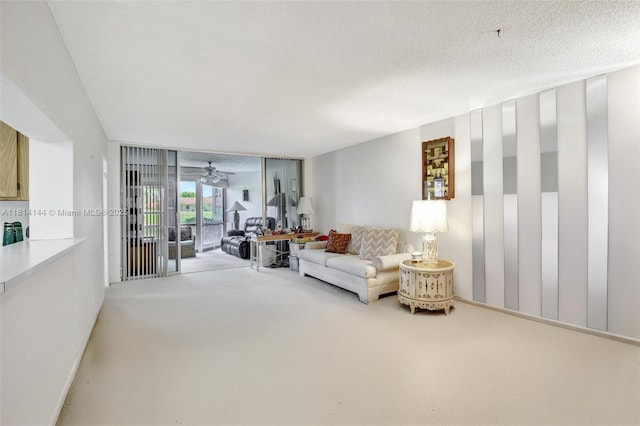 9510 Seagrape Dr Unit 101, Davie, FL 33324 - carpeted living area with a ceiling fan and a textured ceiling