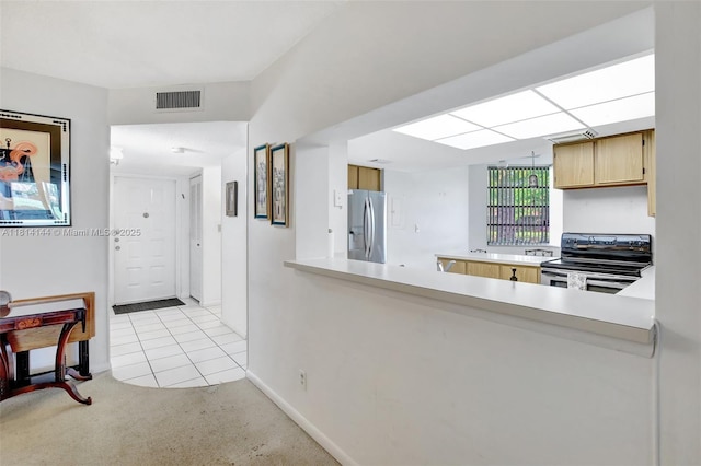 9510 Seagrape Dr Unit 101, Davie, FL 33324 - kitchen featuring range with electric cooktop, stainless steel refrigerator with ice dispenser, light colored carpet, baseboards, and light tile patterned flooring