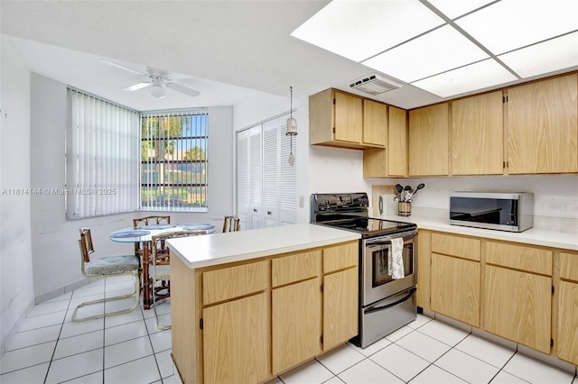 9510 Seagrape Dr Unit 101, Davie, FL 33324 - kitchen featuring appliances with stainless steel finishes, a peninsula, ceiling fan, light countertops, and light tile patterned floors