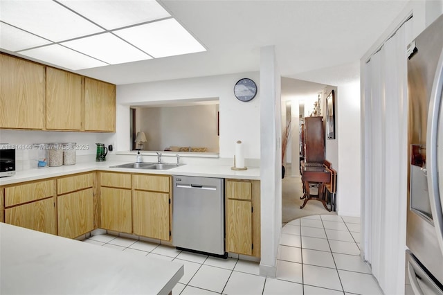9510 Seagrape Dr Unit 101, Davie, FL 33324 - kitchen featuring stainless steel appliances, a sink, light countertops, light brown cabinets, and light tile patterned flooring