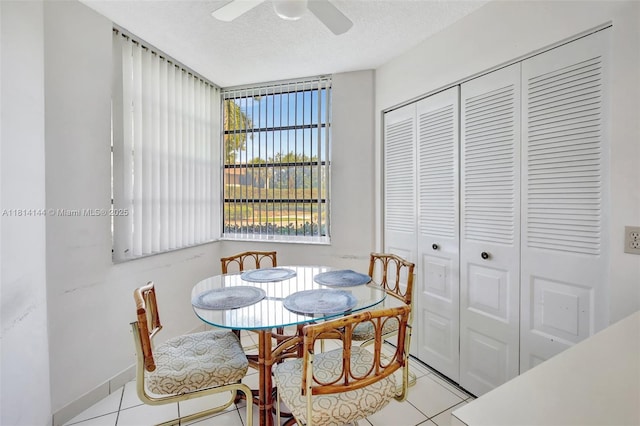 9510 Seagrape Dr Unit 101, Davie, FL 33324 - dining space featuring light tile patterned floors, a ceiling fan, and a textured ceiling