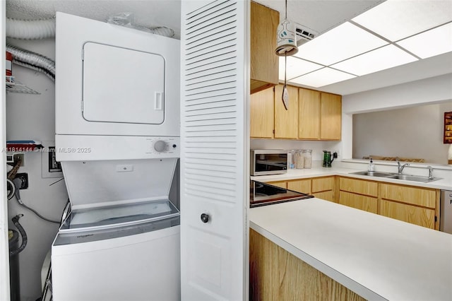 9510 Seagrape Dr Unit 101, Davie, FL 33324 - laundry area featuring stacked washing machine and dryer