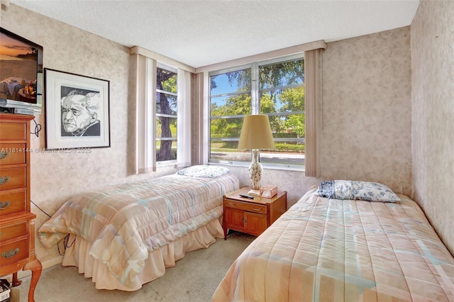9510 Seagrape Dr Unit 101, Davie, FL 33324 - carpeted bedroom featuring wallpapered walls and a textured ceiling