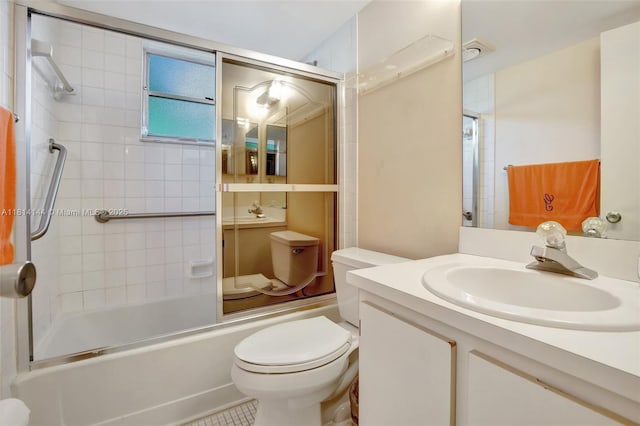 9510 Seagrape Dr Unit 101, Davie, FL 33324 - bathroom featuring toilet, vanity, and bath / shower combo with glass door