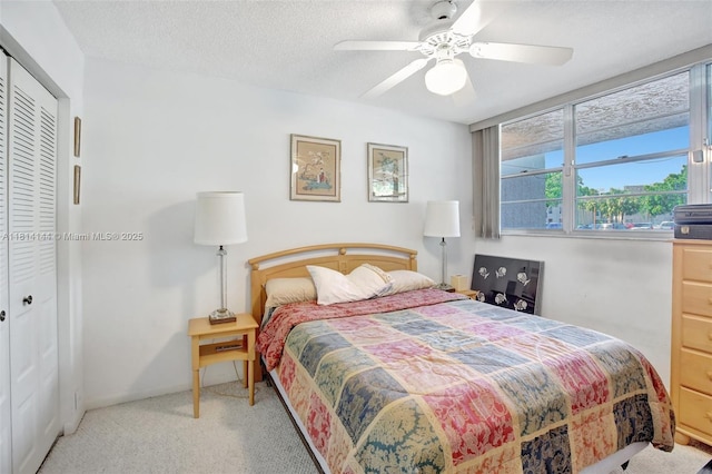 9510 Seagrape Dr Unit 101, Davie, FL 33324 - carpeted bedroom featuring a closet, ceiling fan, and a textured ceiling