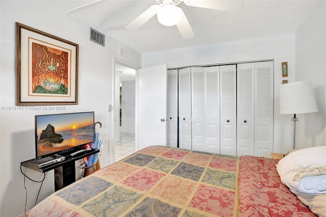 9510 Seagrape Dr Unit 101, Davie, FL 33324 - bedroom with a textured ceiling, a closet, and ceiling fan