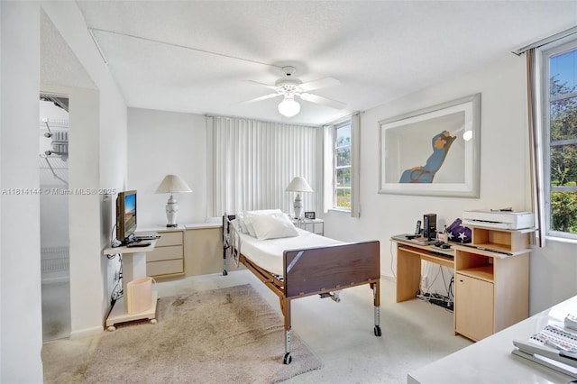 9510 Seagrape Dr Unit 101, Davie, FL 33324 - bedroom with an office area, light colored carpet, baseboards, and ceiling fan