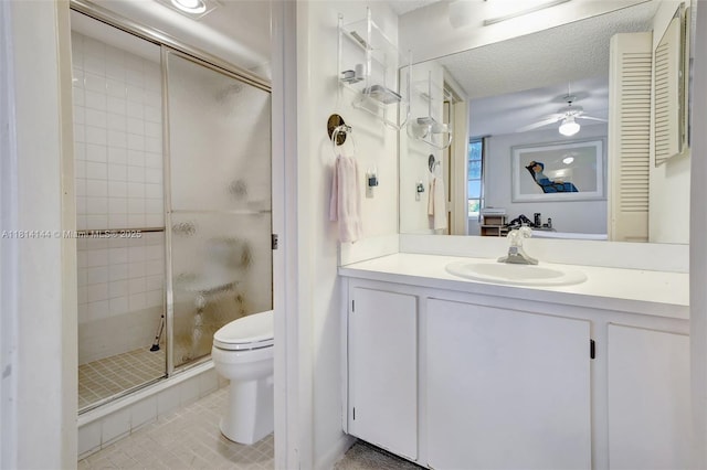 9510 Seagrape Dr Unit 101, Davie, FL 33324 - full bath with toilet, a stall shower, vanity, a ceiling fan, and tile patterned flooring