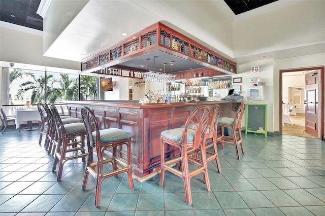 9510 Seagrape Dr Unit 101, Davie, FL 33324 - indoor dry bar with tile patterned floors and a high ceiling