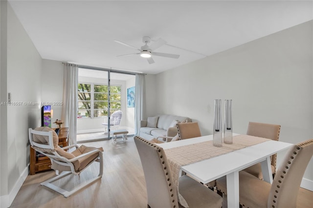 9091 Lime Bay Blvd Unit 211, Tamarac, FL 33321 - dining room featuring a ceiling fan, light wood-style floors, and baseboards