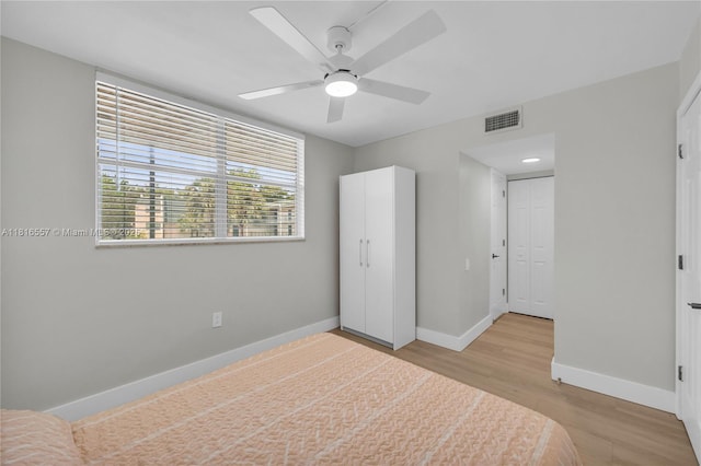 9091 Lime Bay Blvd Unit 211, Tamarac, FL 33321 - unfurnished bedroom featuring baseboards, wood finished floors, and ceiling fan