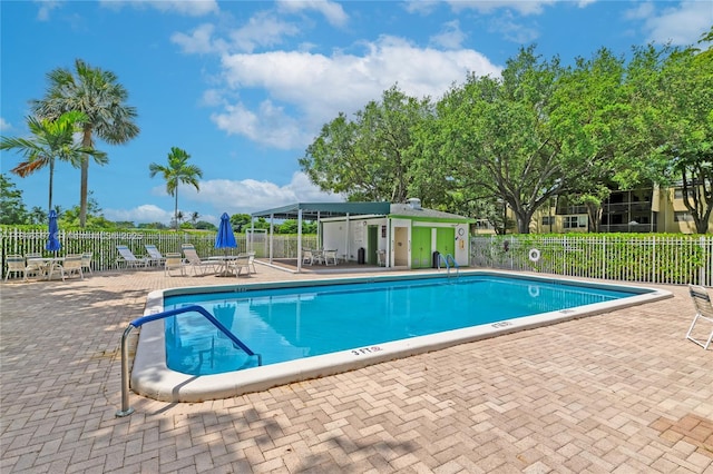 9091 Lime Bay Blvd Unit 211, Tamarac, FL 33321 - community pool featuring a patio area