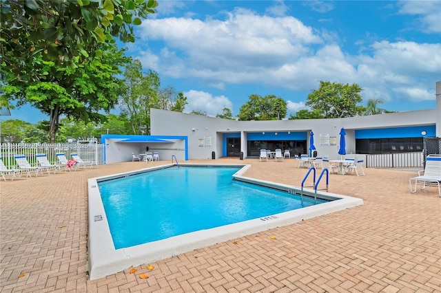 9091 Lime Bay Blvd Unit 211, Tamarac, FL 33321 - community pool featuring a patio area