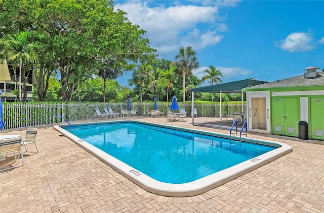 9091 Lime Bay Blvd Unit 211, Tamarac, FL 33321 - community pool featuring a patio area