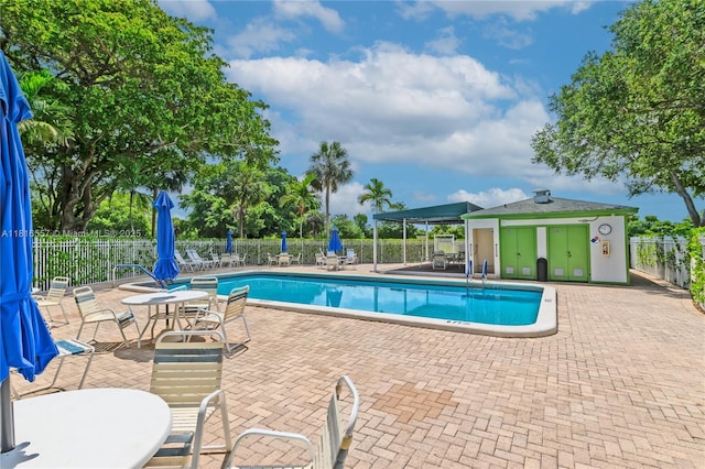 9091 Lime Bay Blvd Unit 211, Tamarac, FL 33321 - community pool featuring a patio area
