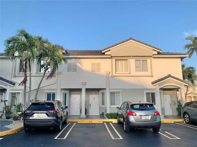 120 SW 109th Ave Unit 3, Sweetwater, FL 33174 - view of property with uncovered parking, a tile roof, and stucco siding