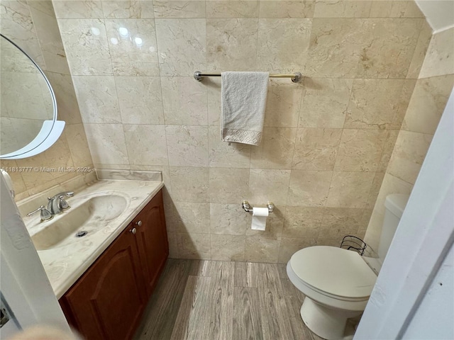 120 SW 109th Ave Unit 3, Sweetwater, FL 33174 - bathroom featuring tile walls, toilet, vanity, and wood finished floors