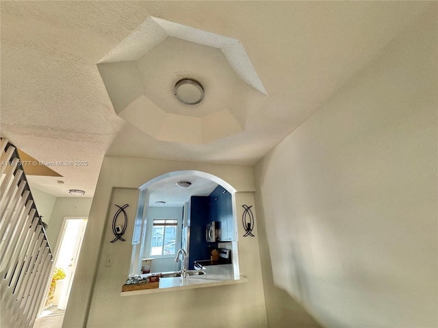 120 SW 109th Ave Unit 3, Sweetwater, FL 33174 - detailed view of a sink, stainless steel microwave, range, and arched walkways