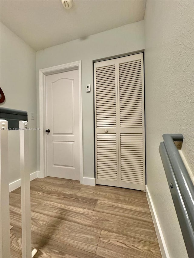120 SW 109th Ave Unit 3, Sweetwater, FL 33174 - corridor featuring wood finished floors, baseboards, and a textured wall