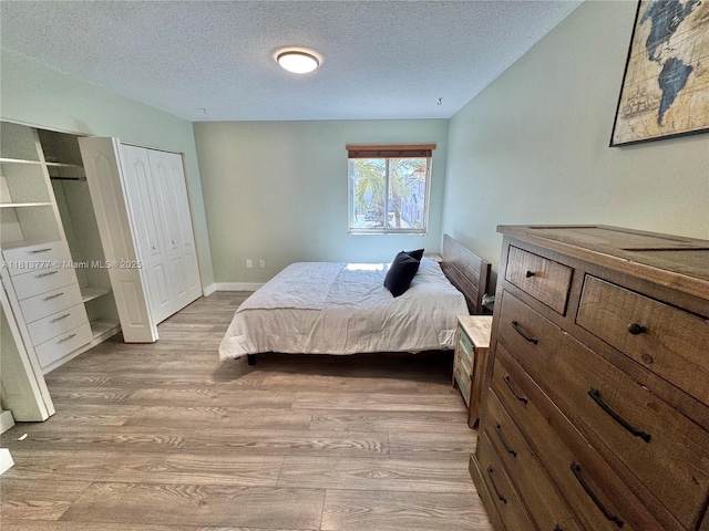 120 SW 109th Ave Unit 3, Sweetwater, FL 33174 - bedroom featuring wood finished floors and a textured ceiling