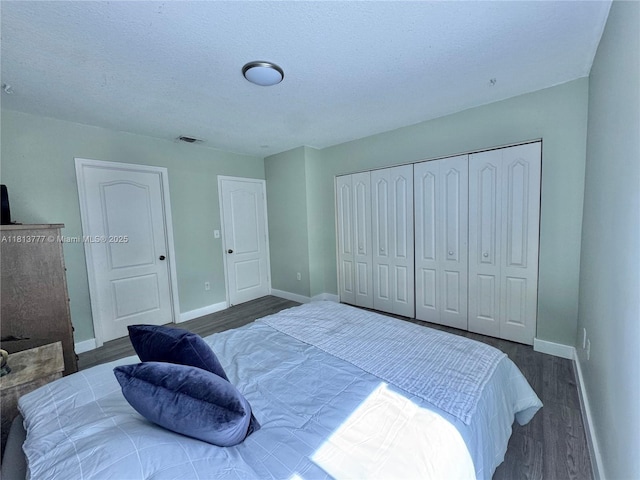 120 SW 109th Ave Unit 3, Sweetwater, FL 33174 - bedroom with wood finished floors, baseboards, a closet, and a textured ceiling