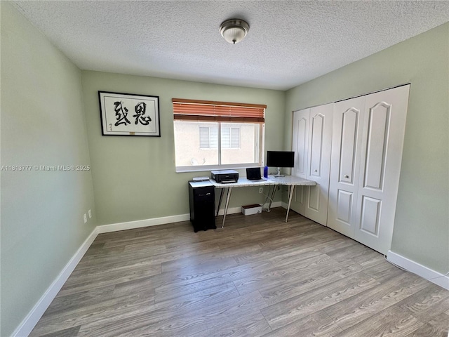 120 SW 109th Ave Unit 3, Sweetwater, FL 33174 - home office with wood finished floors, a textured ceiling, and baseboards