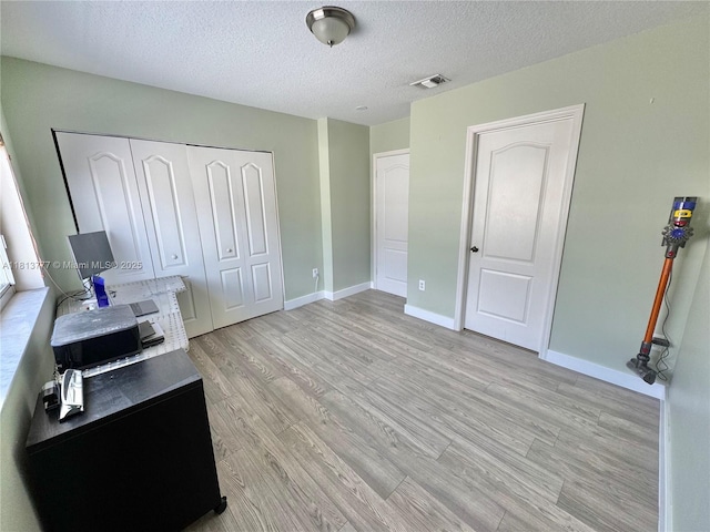 120 SW 109th Ave Unit 3, Sweetwater, FL 33174 - office area with light wood finished floors, a textured ceiling, and baseboards