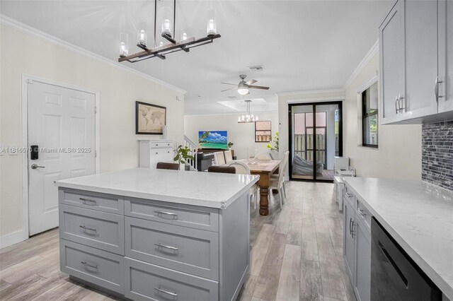 628 SE 37th Pl, Homestead, FL 33033 - kitchen with gray cabinets, a chandelier, stainless steel dishwasher, crown molding, and light wood-style floors