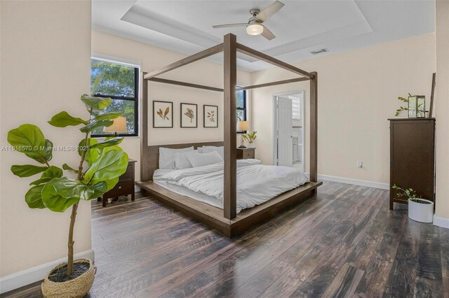 628 SE 37th Pl, Homestead, FL 33033 - bedroom featuring a raised ceiling, wood finished floors, baseboards, and ceiling fan