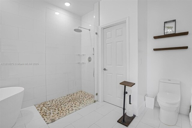628 SE 37th Pl, Homestead, FL 33033 - bathroom with tiled shower, a freestanding bath, and toilet