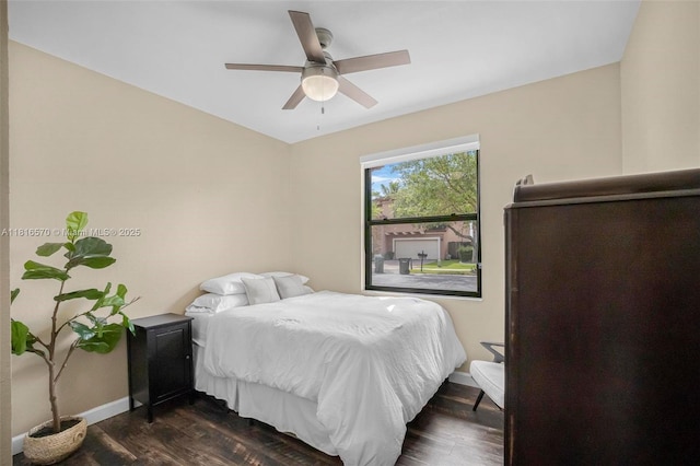 628 SE 37th Pl, Homestead, FL 33033 - bedroom with dark wood-style floors, a ceiling fan, and baseboards