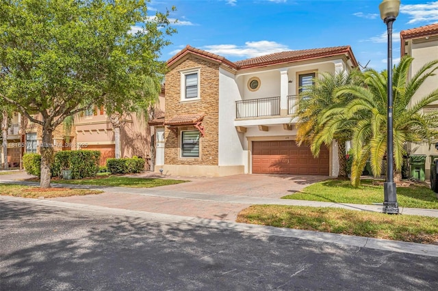628 SE 37th Pl, Homestead, FL 33033 - mediterranean / spanish house with a balcony, stucco siding, a tiled roof, an attached garage, and driveway