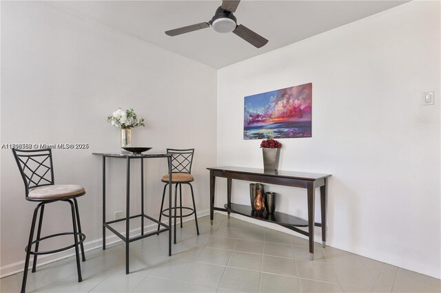 430 Golden Isles Dr Unit 301, Hallandale Beach, FL 33009 - living area with baseboards and ceiling fan