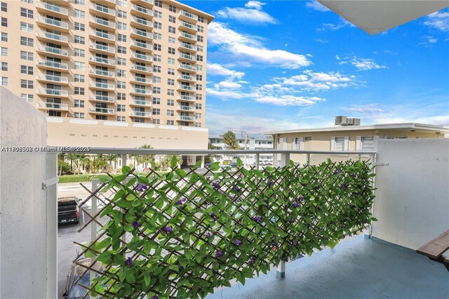 430 Golden Isles Dr Unit 301, Hallandale Beach, FL 33009 - balcony with central AC unit