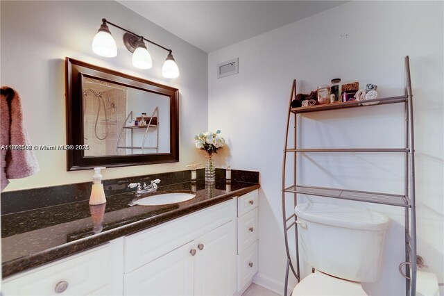 430 Golden Isles Dr Unit 301, Hallandale Beach, FL 33009 - bathroom with vanity and toilet