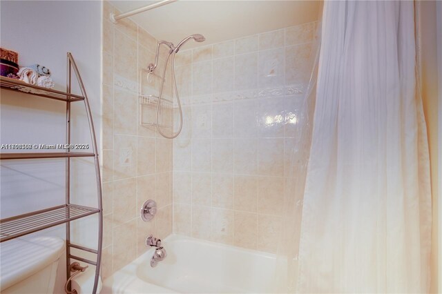 430 Golden Isles Dr Unit 301, Hallandale Beach, FL 33009 - bathroom with shower / bath combo with shower curtain and toilet