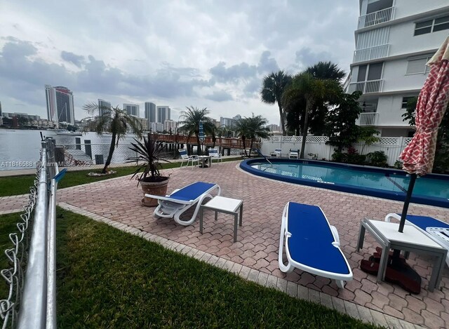 430 Golden Isles Dr Unit 301, Hallandale Beach, FL 33009 - community pool with a patio and a city view