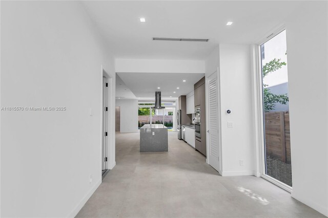 3122 Carter St, Miami, FL 33133 - corridor featuring recessed lighting, finished concrete floors, and baseboards