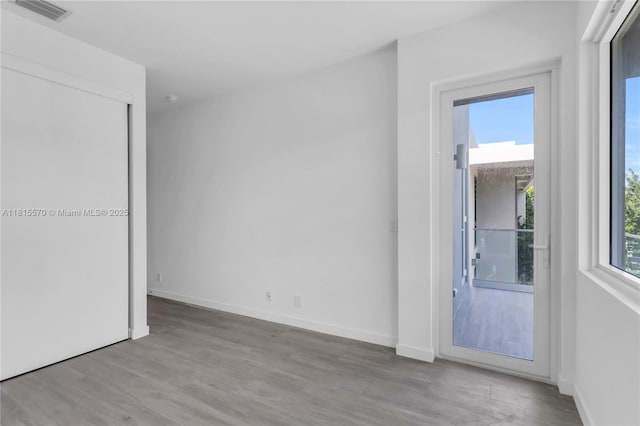 3122 Carter St, Miami, FL 33133 - unfurnished room with wood finished floors and baseboards
