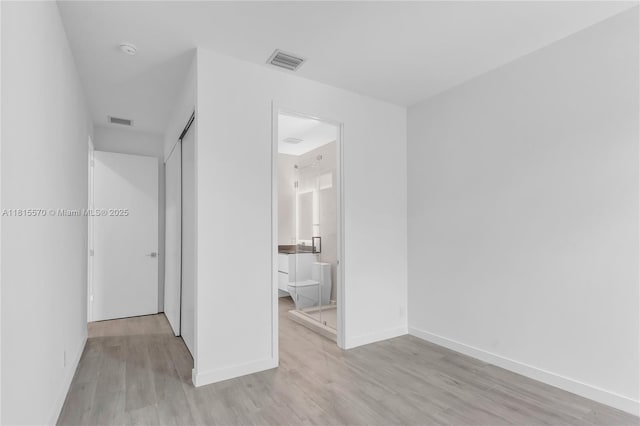 3122 Carter St, Miami, FL 33133 - spare room with light wood-type flooring, baseboards, and a smoke detector