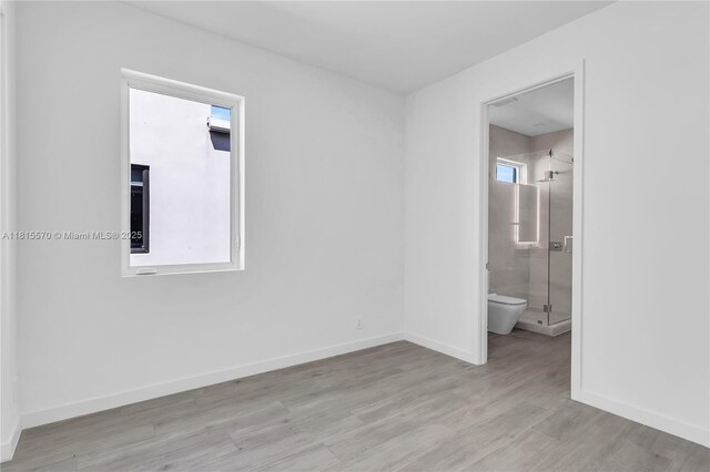 3122 Carter St, Miami, FL 33133 - unfurnished room with wood finished floors, baseboards, and healthy amount of natural light