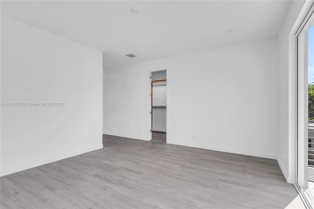 3122 Carter St, Miami, FL 33133 - empty room with wood finished floors and baseboards