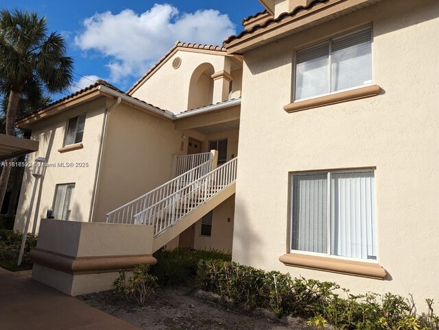 15201 Glenmoor Dr Unit 15201, West Palm Beach, FL 33409 - view of building exterior with stairs