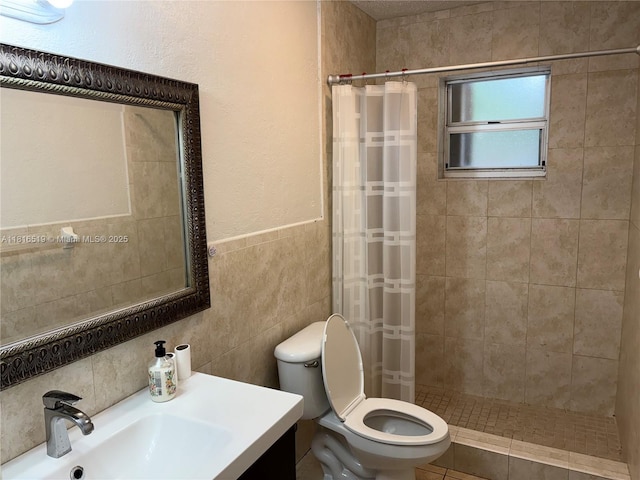 661 E 44th St, Hialeah, FL 33013 - full bathroom with a tile shower, tile walls, and vanity