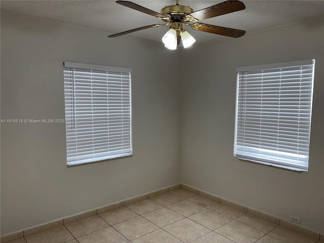 661 E 44th St, Hialeah, FL 33013 - empty room featuring light tile patterned flooring, a ceiling fan, and a textured ceiling