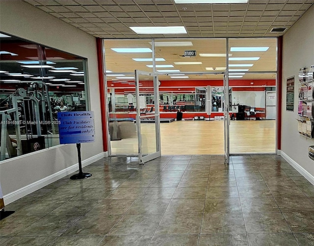 1401 SW 134th Way Unit 412C, Pembroke Pines, FL 33027 - gym featuring tile patterned floors and a paneled ceiling