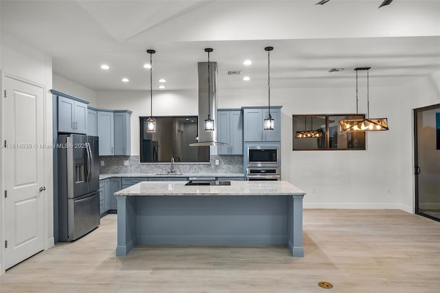 4308 3rd St SW, Lehigh Acres, FL 33976 - kitchen featuring stainless steel appliances, a sink, backsplash, recessed lighting, and light wood-type flooring