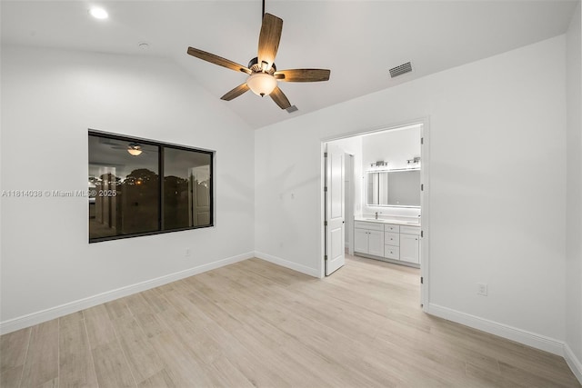 4308 3rd St SW, Lehigh Acres, FL 33976 - empty room featuring ceiling fan, light wood-type flooring, vaulted ceiling, and baseboards